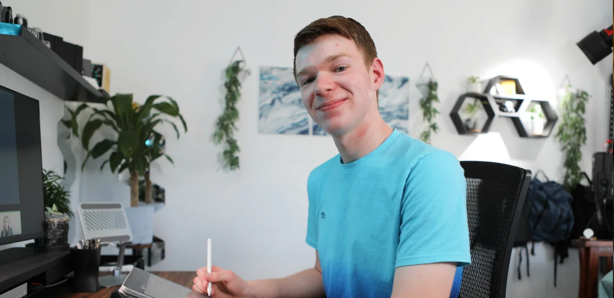 Student taking notes at home